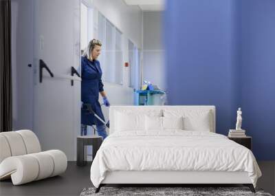 women at workplace, professional female cleaner washing floor in Wall mural