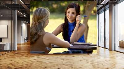 young college students talking and studying for university exam Wall mural