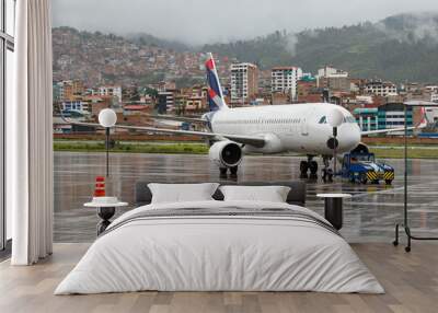 Avion comercial remolcado, Cusco - Aeropuerto Alejandro Velasco Astete - Airplane being pushed back, Cusco, Peru Wall mural