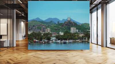 Piscinão de Ramos, located in the Ramos neighborhood in Rio de Janeiro, with some fishing boats and in the background the church of Penha Wall mural