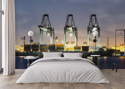 Cargo ship at dock, port or harbor. To loading cargo container, work with crane. Concept of business and industry i.e. shipping, logistics, international trade, freight transport and import export. Wall mural