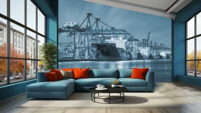 Gantry crane loading and unloading cargo container  from cargo ship at port to show global international logistics and transportation by cargo ship and cargo container, Logistic import export concept. Wall mural