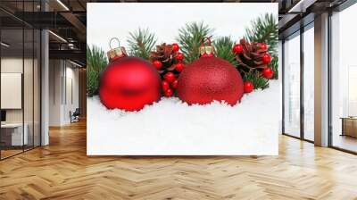 Festive Christmas ornaments nestled among snow-covered fir branches, evoking a winter holiday spirit. Wall mural