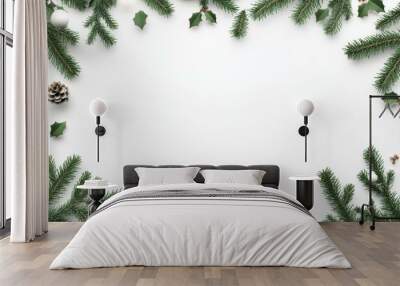 Festive fir branches with pine cones on a white background, evoking a Christmas holiday atmosphere. Wall mural