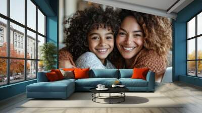 Happy woman hugging laughing daughter while using laptop, surfing internet or watching film together on sofa at home, Generative AI Wall mural