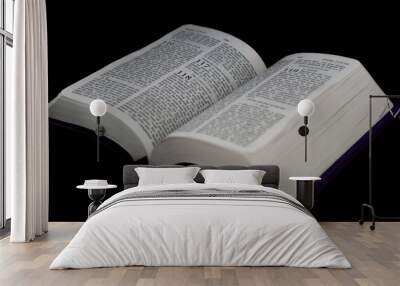 open Bible to psalm 118 isolated on a black background. Wall mural