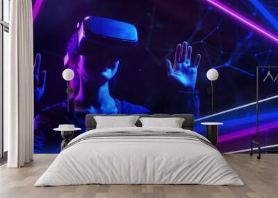 Metaverse virtual event future game entertainment digital technology . Teenager having fun play VR virtual reality glasses sport game metaverse NFT game 3D cyber space futuristic neon background. Wall mural