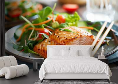 a plate of salmon with chopsticks on it and a salad in the background Wall mural