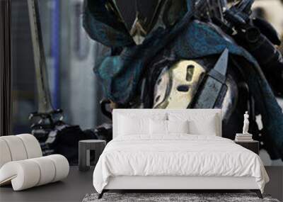 Space hunter, science fictional armored marine posing with multiple weapons and sword in hand. 3d rendering Wall mural