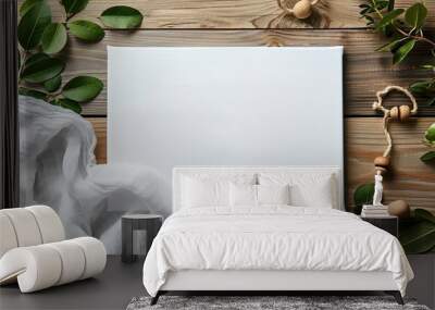 A blank canvas on a rustic wooden surface with natural elements Wall mural