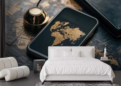 A smartphone displaying a golden world map rests on a vintage map background, blending technology with exploration. Wall mural