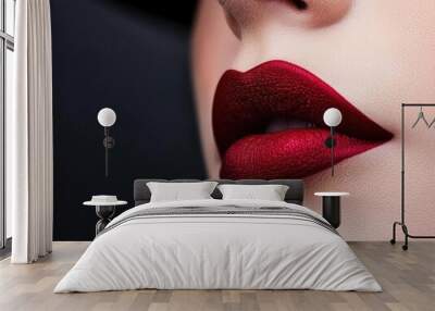 Close-up of luscious red lips on a blurred dark background, highlighting beauty and elegance with a touch of glamour. Wall mural