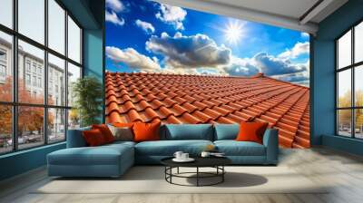 Red-brown roof tiles on a sunny day with blue sky and white clouds Wall mural