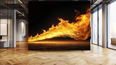 Side profile of flames leaping from a source in the distance, illuminating the darkness. Wall mural