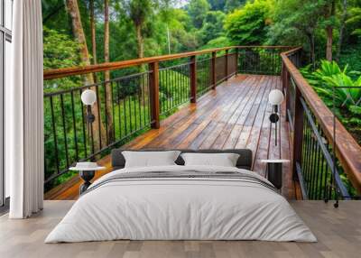 Weathered wooden deck with rusty metal railing, surrounded by lush greenery, showcases a distressed, earthy atmosphere with warm brown tones and subtle grain textures. Wall mural