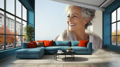 Woman in her sixties seventies, elderly elder older beautiful woman with gray hair is laughing and smiling, mature old woman with healthy face ans skin and white teeth Wall mural