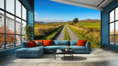 Narrow country road set against a backdrop of clear blue skies Wall mural