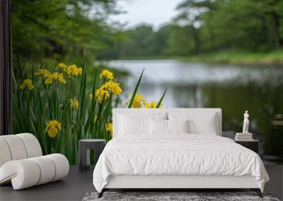 Yellow iris flowers blooming amid lush greenery by the water s edge on a spring day Wall mural