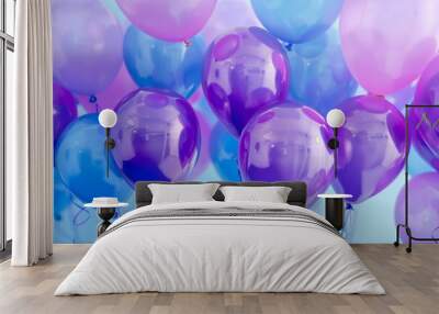 Bunch of purple and blue balloons floating in the air, creating an atmosphere filled with joyous celebration Wall mural