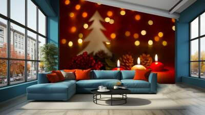 Christmas candles and ornaments over dark background with lights Wall mural