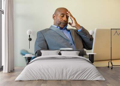 African American man having a difficult time at work. Wall mural