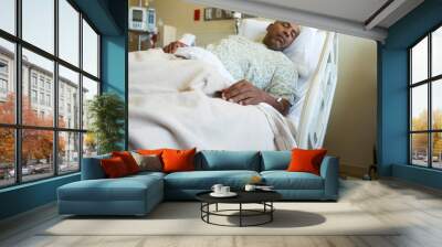 African American man in a hospital bed. Wall mural