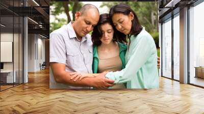 family praying together Wall mural