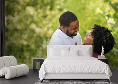 Happy African American couple laughing and smiling. Wall mural