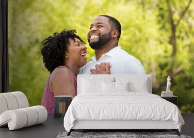 Happy African American couple laughing and smiling. Wall mural