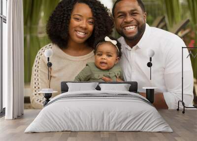 Happy African American family with their baby. Wall mural