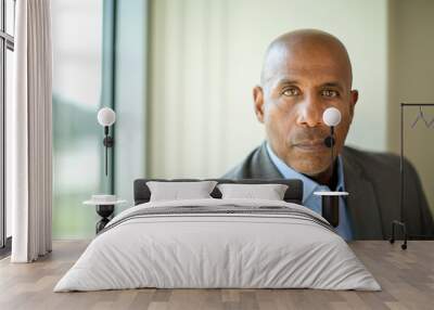 Happy mature African American man at work. Wall mural