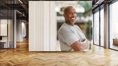 Happy mature African American man smiling outside. Wall mural