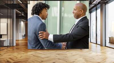 mature african american casually dressed businessman shaking hands. Wall mural