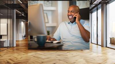 Mature African American man working from his home office. Wall mural