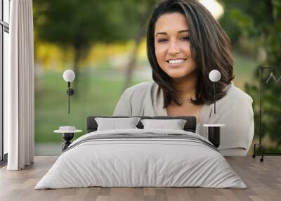 Young confident happy Hispanic woman smiling outside. Wall mural