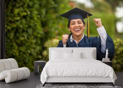 Young hispanic female graduate at her graduation Wall mural