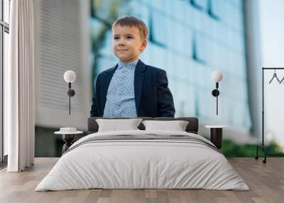 Boy in classic dark blue business costume  Wall mural