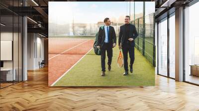 Two businessmen walking and communicating Wall mural