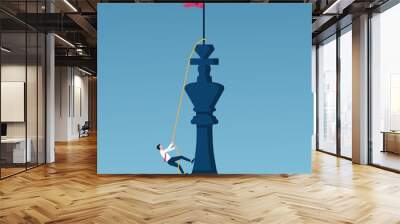 Business target and career growth concept. Businessman climbing a king chess on a rope to achieve success. Wall mural