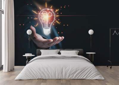 Businessman holding half of virtual lightbulb and brain on blue bokeh background , Smart thinking idea and inspiration innovation concept. Wall mural