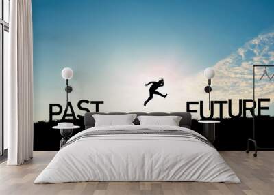 Go ahead and continuously improvement concept, silhouette man jump on a cliff from past to future with cloud sky background. Wall mural