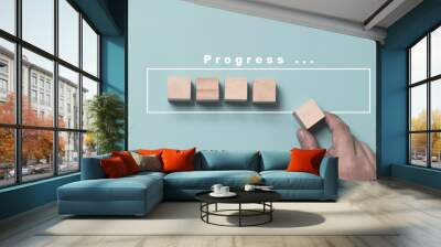 Hand putting and array wooden cube stacking for job and technology progress update concept. Wall mural