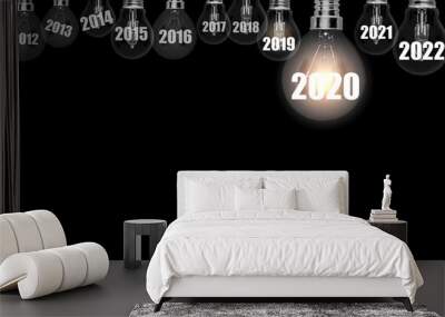 Light bulb with number 2020. Holiday and start new year celebration. Wall mural