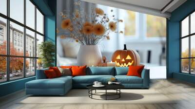 Surprising an orange jack lantern pumpkin with a carved face on a white table Wall mural