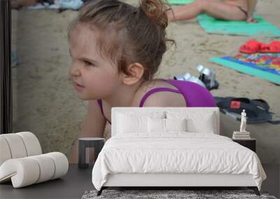 girl playing on the beach on summer holidays. Children building a sandcastle at sea Wall mural