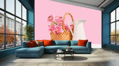 A decorative wicker basket with flowers and a white water jug. Summer floral arrangement. Wall mural