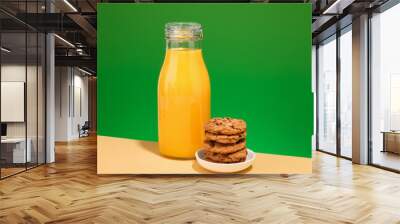 Fresh orange juice and cookies with chocolate chunks. Delicious breakfast. Wall mural