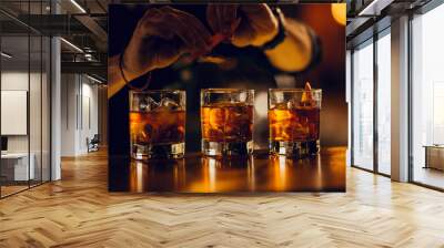 hand making three cocktails on the bar Wall mural