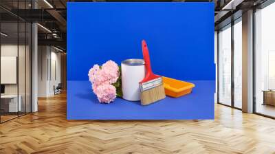 Home renovation project. Construction tools. Paint can, brush, roller tray. Wall mural