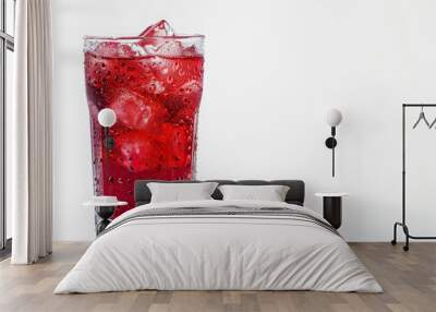 Chilled red drink with ice in a clear glass on a white background Wall mural